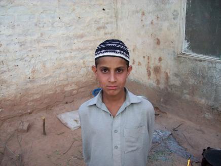  A boy from Pakistan's Swat valley now resides an an abandoned building outside Islamabad. (Photo: Dan Pearson)